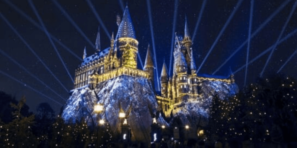 The Harry Potter Castle at Universal Orlando lit up at night.