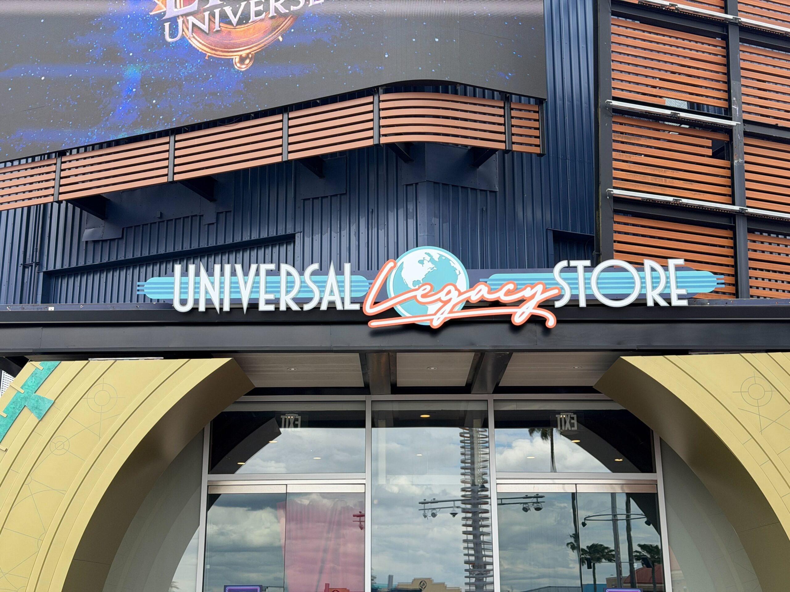 Epic Universe Preview Center Closes as Universal Legacy Store Sign Goes Up at CityWalk 2 Close up of Universal Legacy Store retro sign at CityWalk Orlando entrance archway