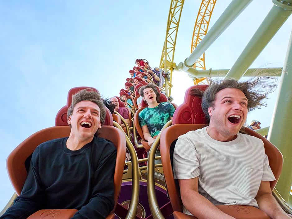Epic Universe Closes at 6 p.m. October 10 and November 19 1 Teen riders smiling aboard Stardust Racers at Epic Universe
