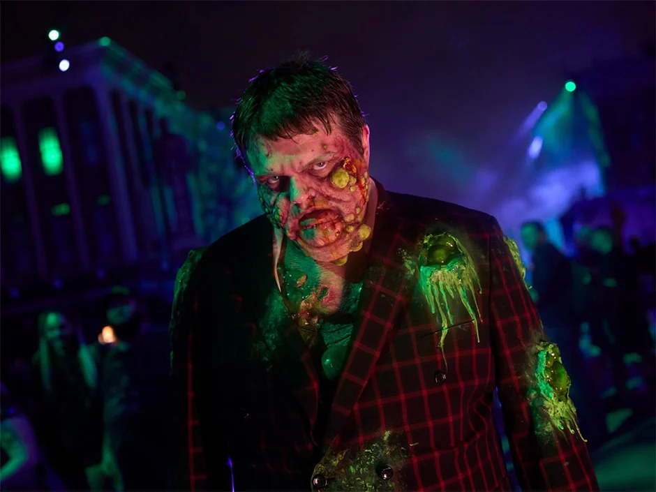 Halloween Horror Nights 2026 Tickets & Passes Guide 2 Scare actor in the Toxic Twenties scare zone at Halloween Horror Nights