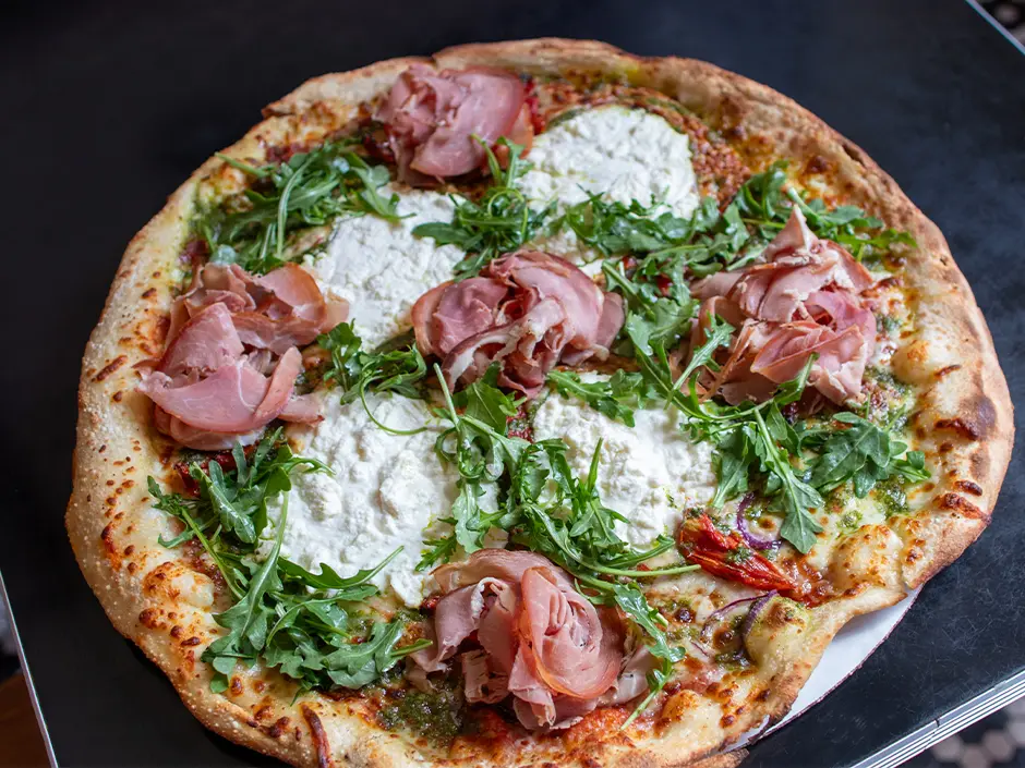 Universal Orlando Passholder Appreciation Days 2026 Menu Revealed 1 Prosciutto and arugula pizza from Louies Italian Restaurant for Universal Orlando Passholder Appreciation Days