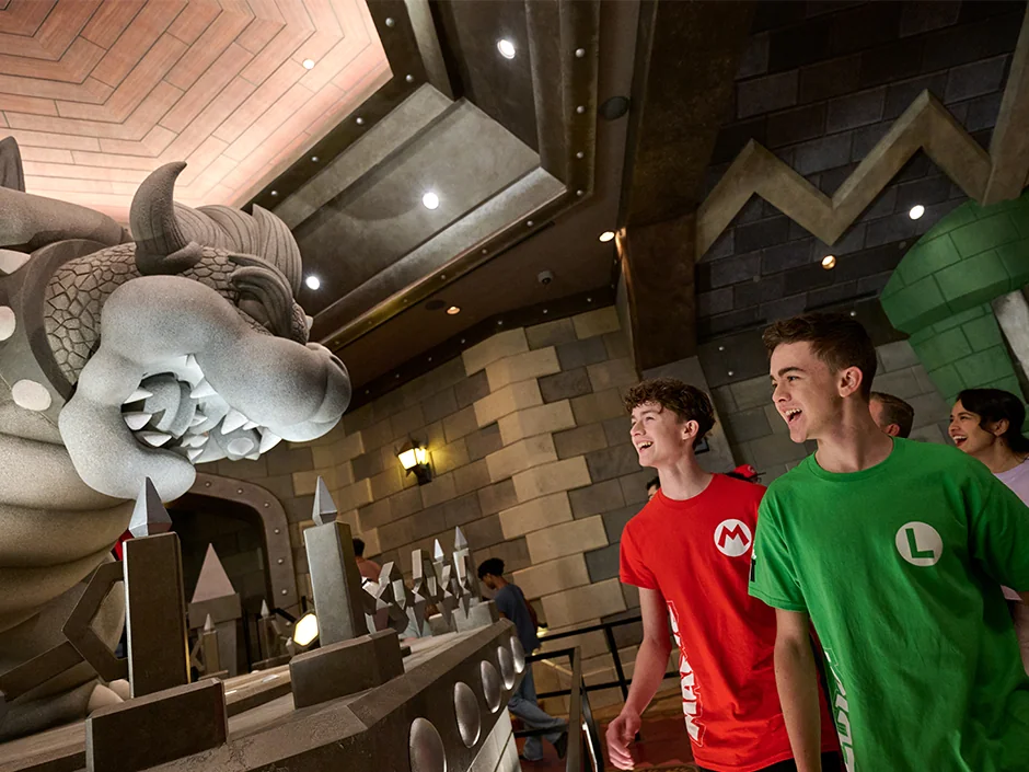 Mario Kart: Bowser's Challenge at Epic Universe: How the Race Really Works 1 Guests viewing the Bowser statue in the Mario Kart: Bowser’s Challenge queue