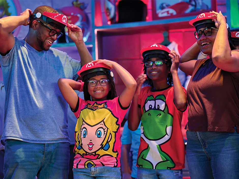 Mario Kart: Bowser's Challenge at Epic Universe: How the Race Really Works 2 Guests preparing visors before boarding Mario Kart: Bowser’s Challenge