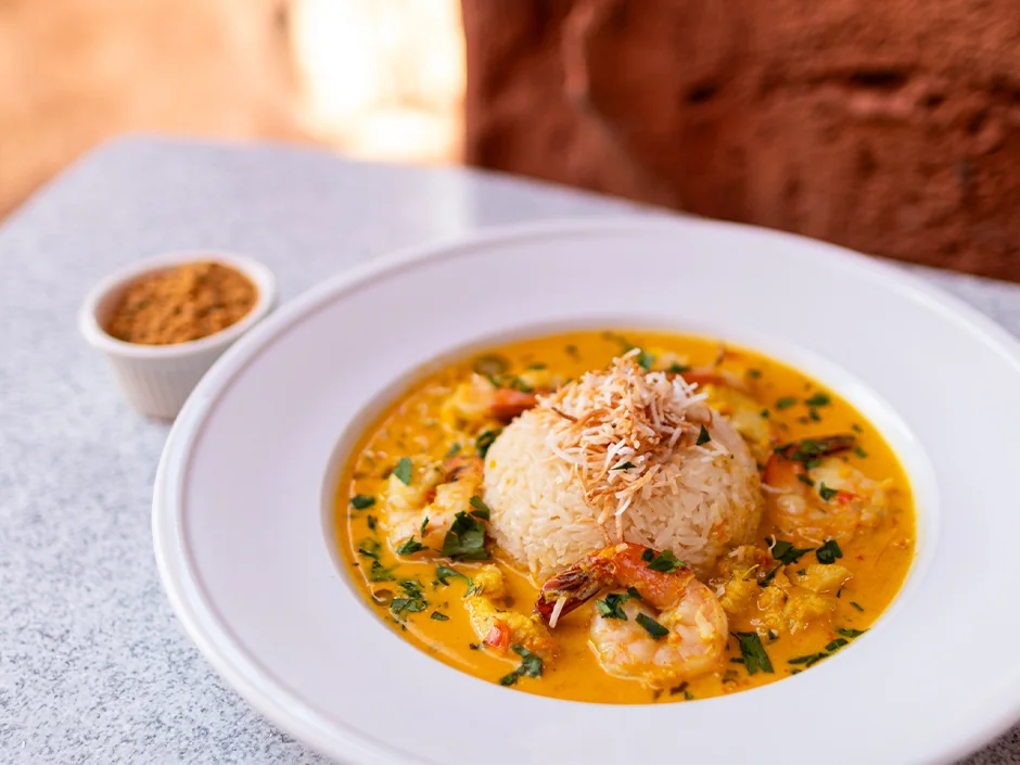 Universal Orlando Adds Hispanic and Latino Heritage Month Menus Across the Resort 2 Shrimp and grouper moqueca with coconut rice at Mythos