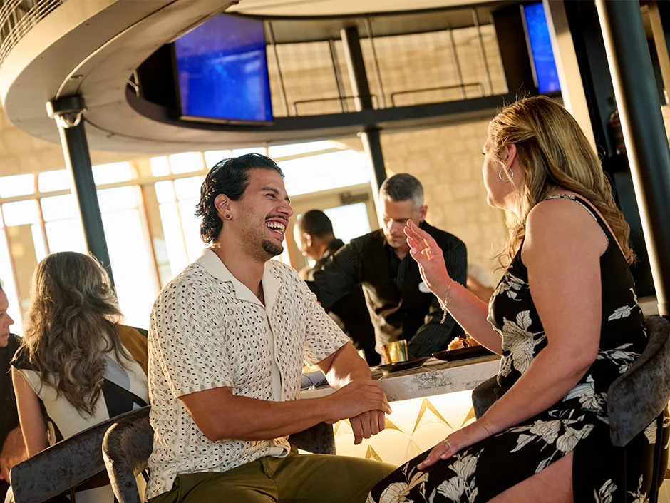Exploring Adult Beverages at Universal Orlando Resort 3 Guests seated at Bar Helios at Universal Helios Grand Hotel