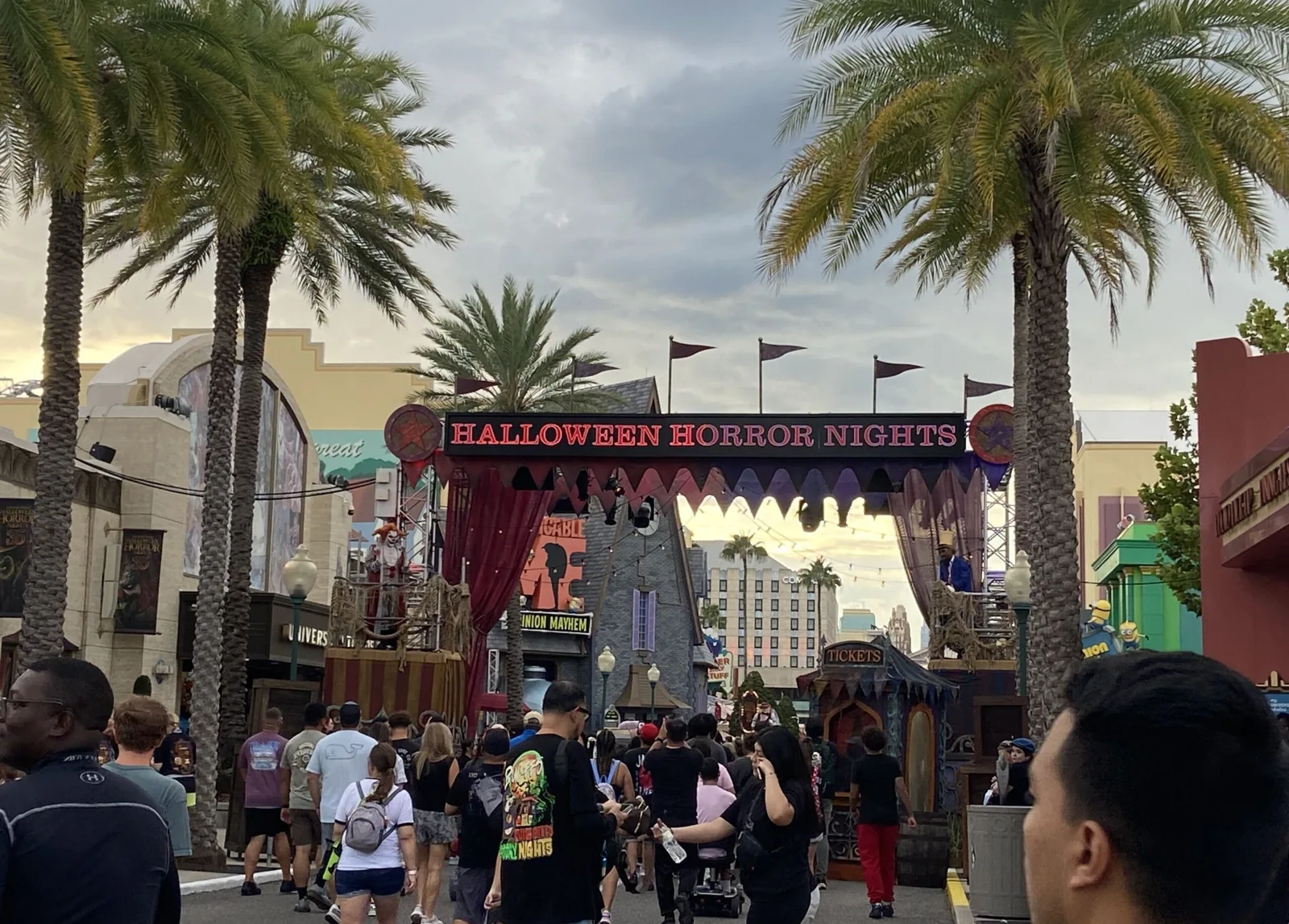 Halloween Horror Nights Queue Announcement Reminds Guests Not to Touch Performers 1 Guests walking toward the Infernal Carnival of Nightmares entrance