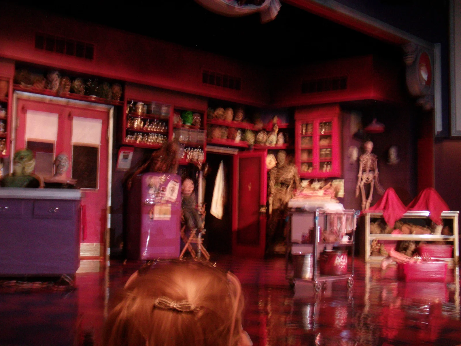 Universal's Horror Make-Up Show Adds Blumhouse for Its Return 1 Horror Make-Up Show stage with creature props, cabinets and a skeleton in 2010