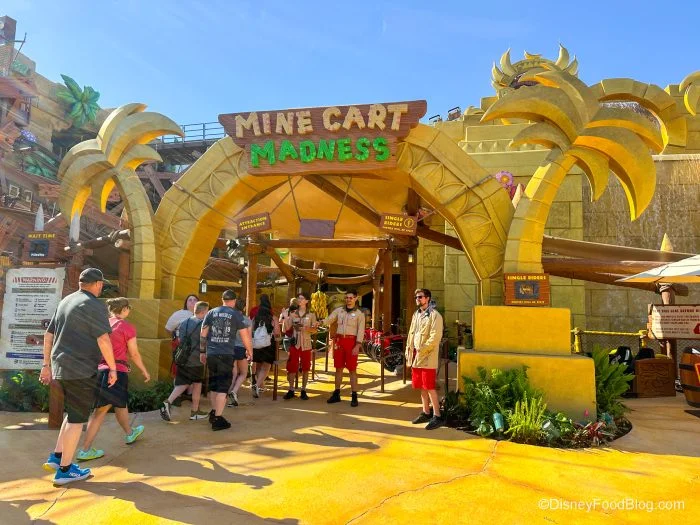 Epic Universe Crowds Ease, but Two Rides Still Need a Plan 5 Guests entering Mine-Cart Madness beneath its yellow arch